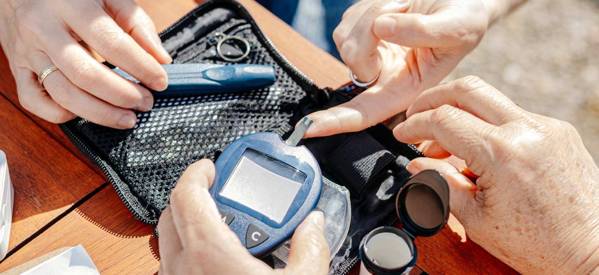 Stock photo of person checking blood glucose levels